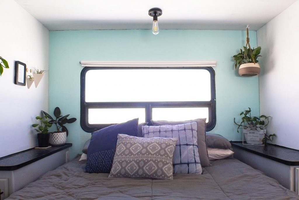 Adding throw pillows and a blanket can change the overall look of your RV's bedroom.