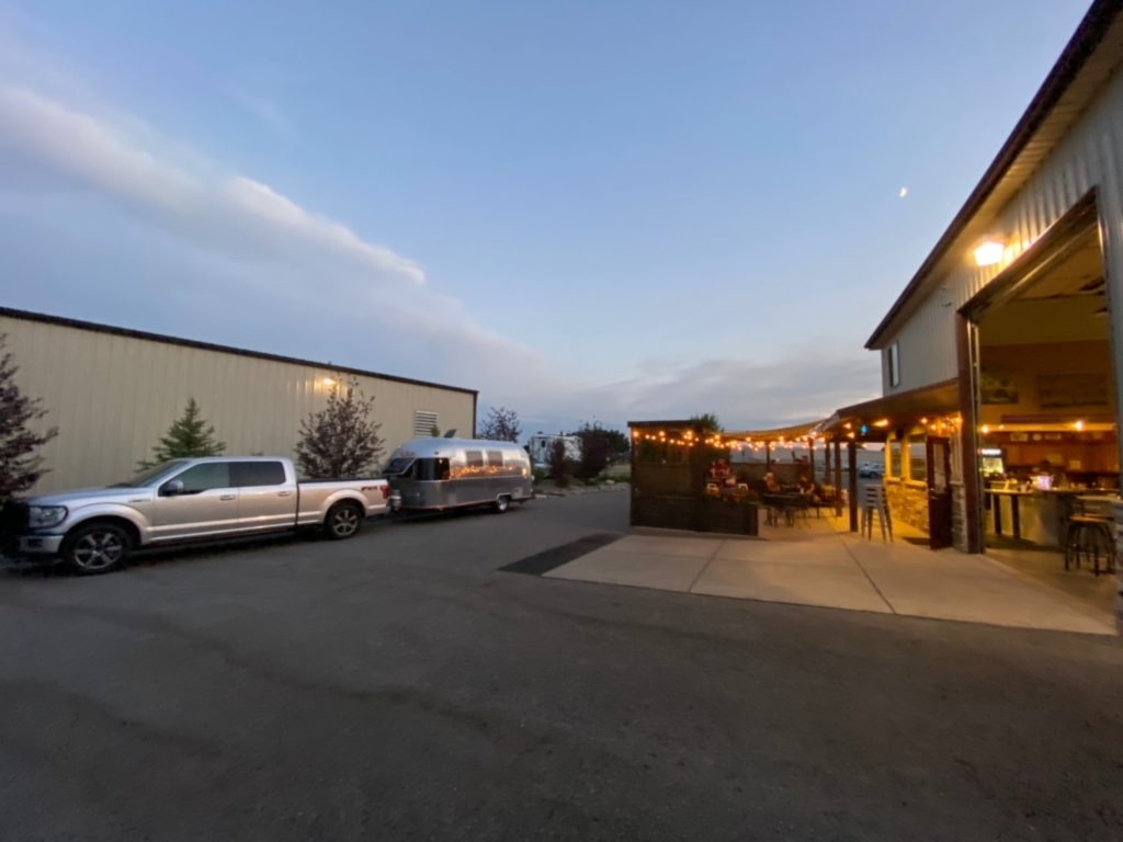 A Harvest Hosts guests' trailer sits parked outside the winery.