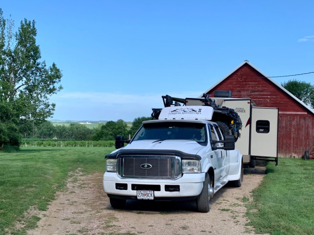 A truck and trailer sit parked on the property for Wilde Prairie Winery.