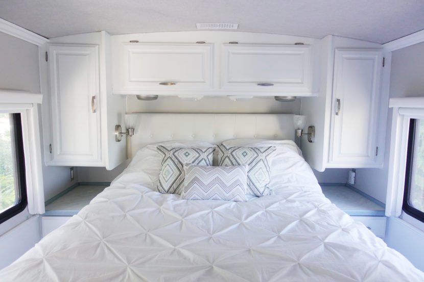 Add some new bedding and pillows to make the space our own.