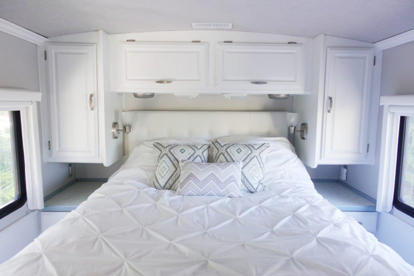 Add some new bedding and pillows to make the space our own.